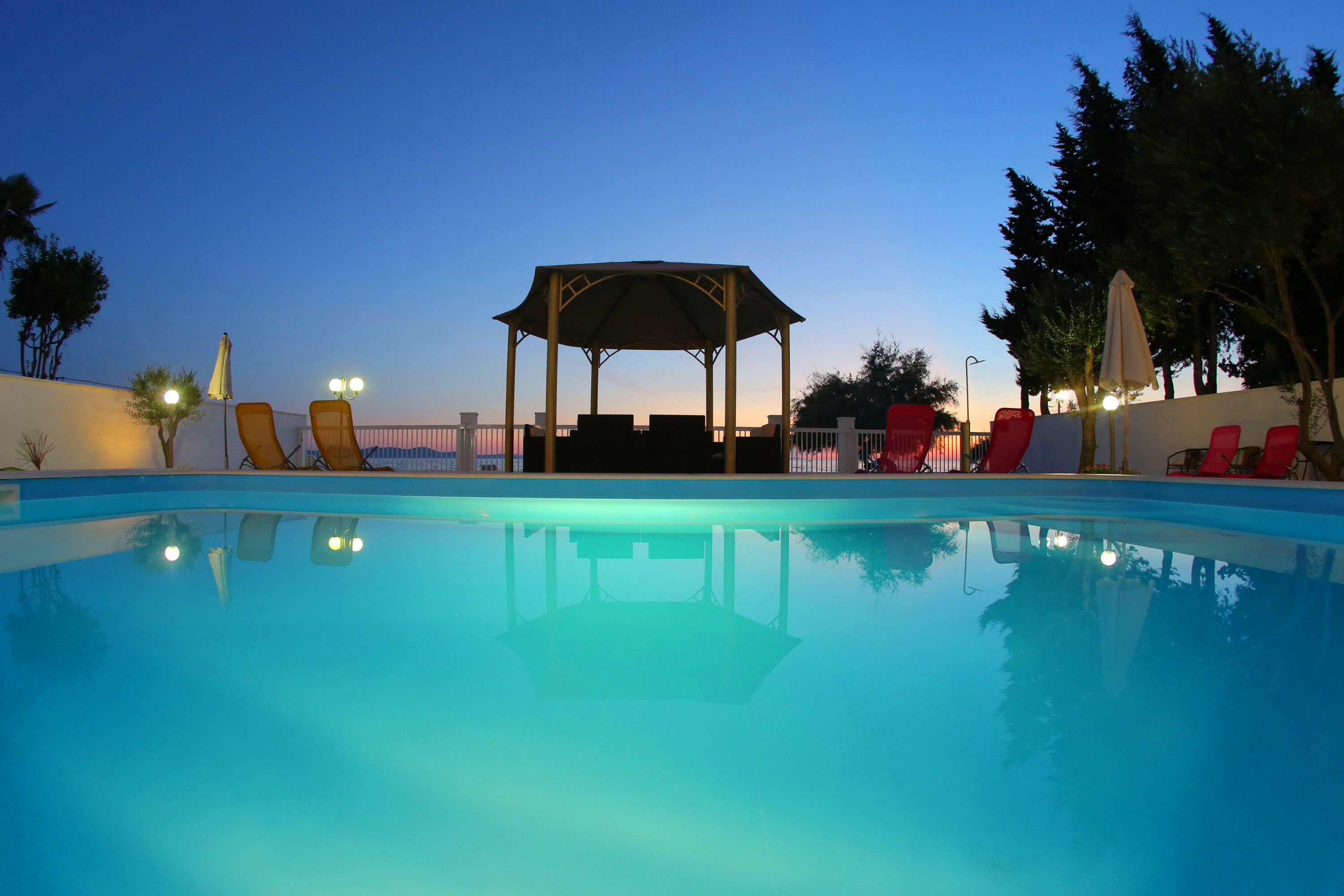 Seasonal outdoor pool, pool umbrellas, pool loungers