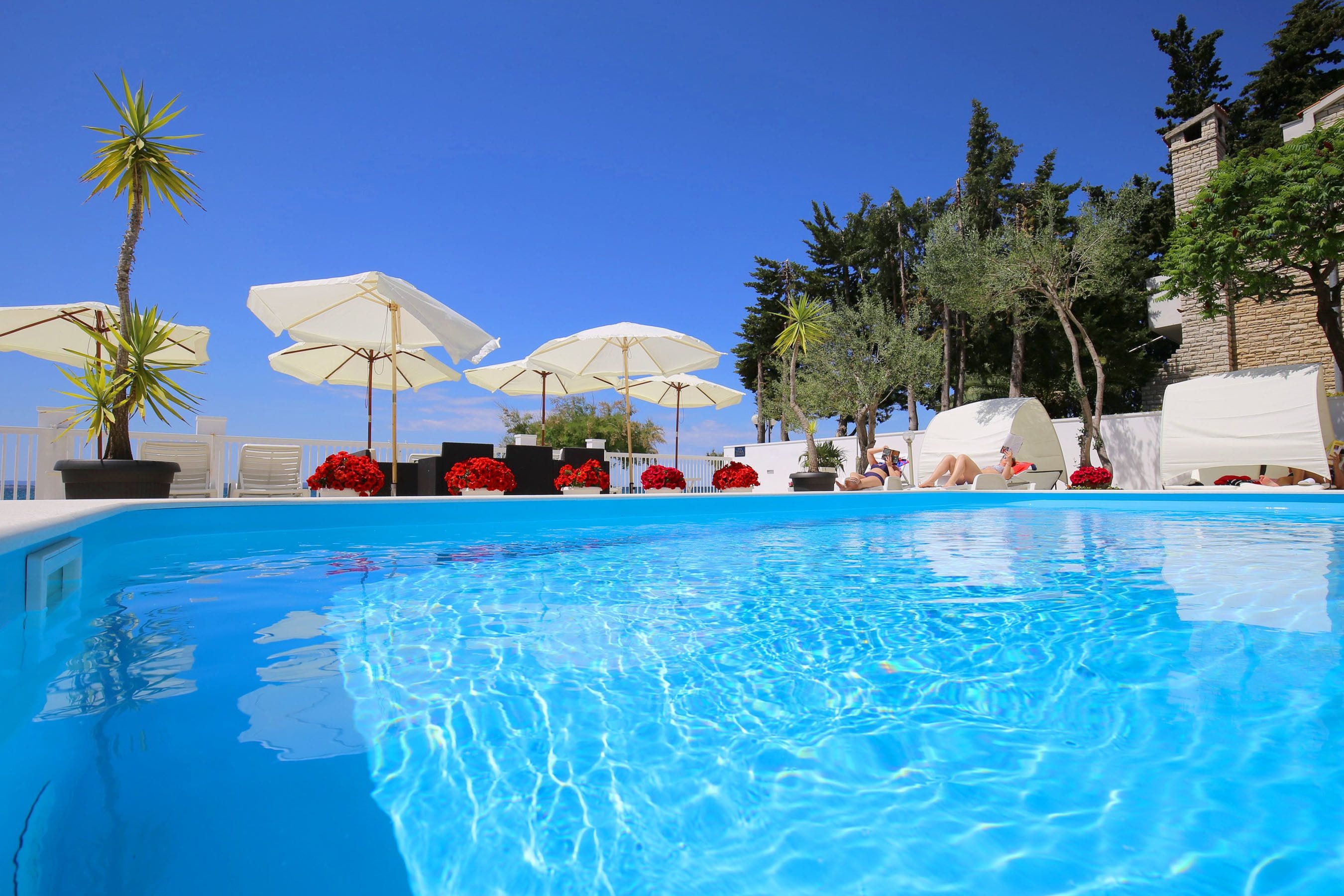 seasonal outdoor pool, pool umbrellas, pool loungers
