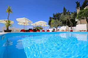 Seasonal outdoor pool, pool umbrellas, pool loungers