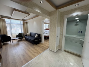 Double Room | Minibar, in-room safe, desk, iron/ironing board
