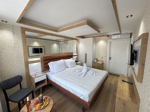 Double Room | Minibar, in-room safe, desk, iron/ironing board