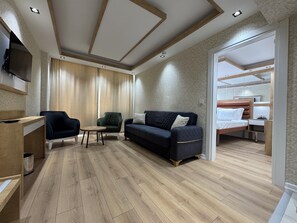 Double Room | Minibar, in-room safe, desk, iron/ironing board