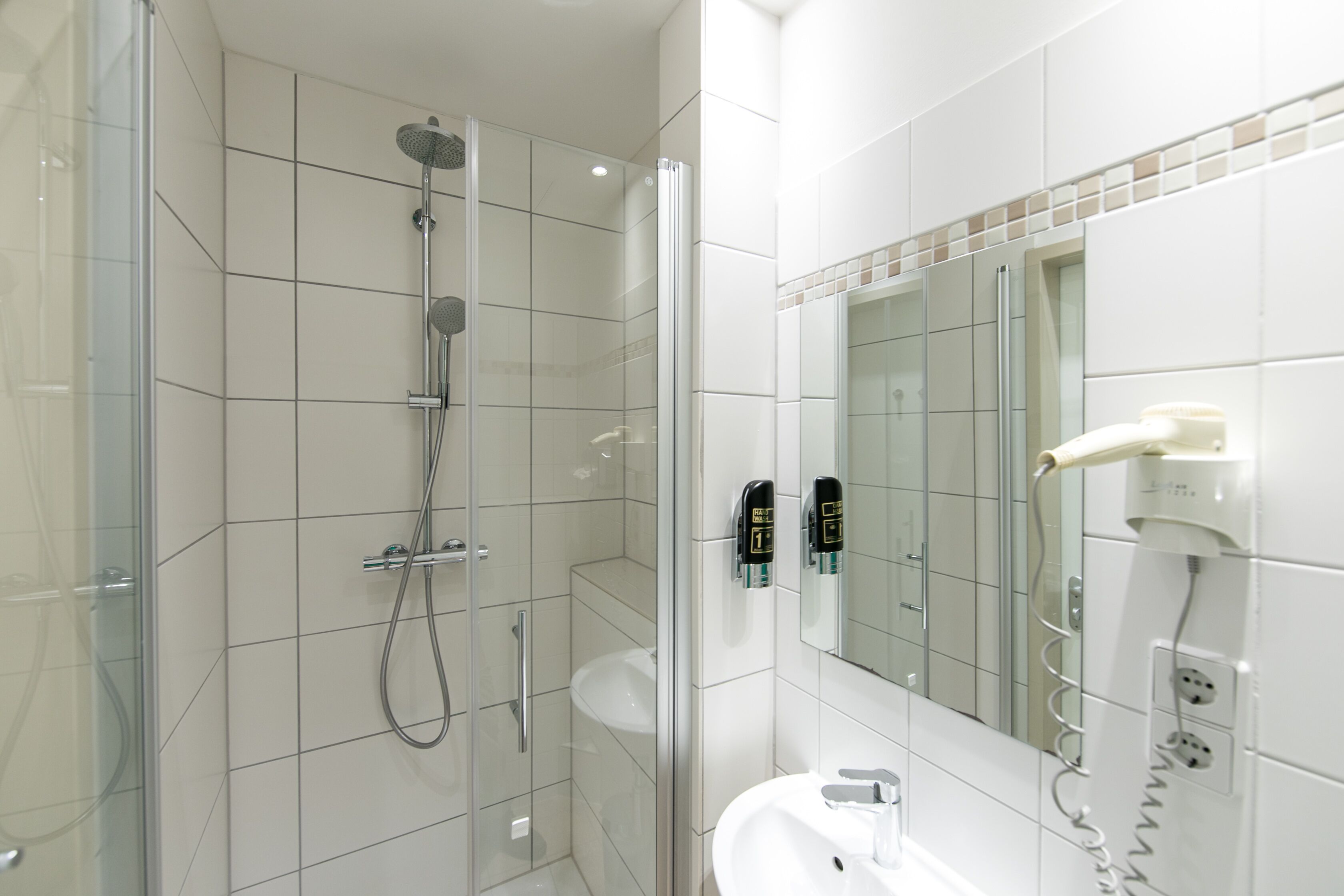 shower, free toiletries, hair dryer, towels