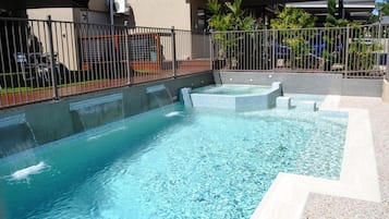 Outdoor pool, open 9:00 AM to 6:00 PM, pool loungers