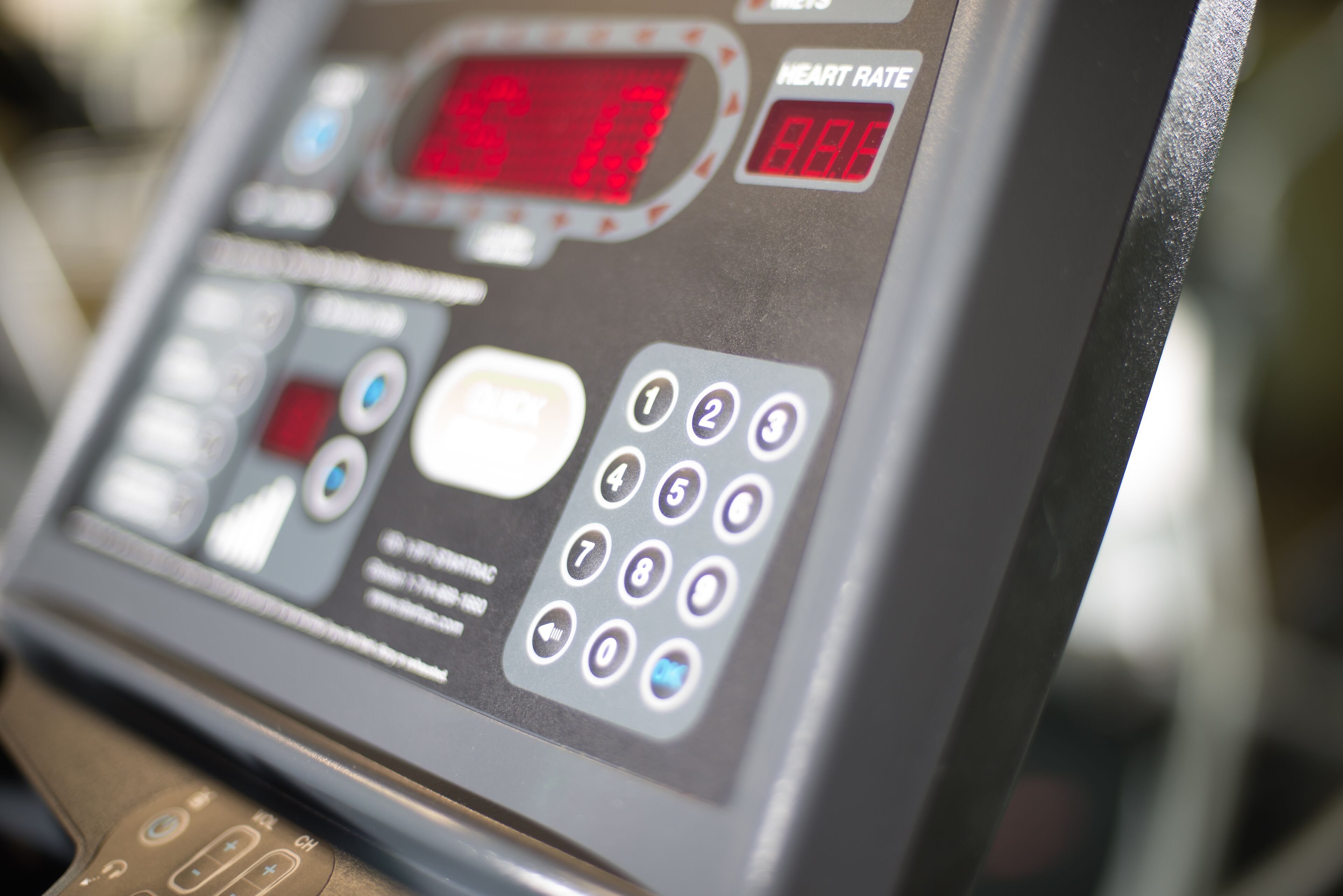 A medical device with a digital display and numerical readout, possibly a heart rate monitor.