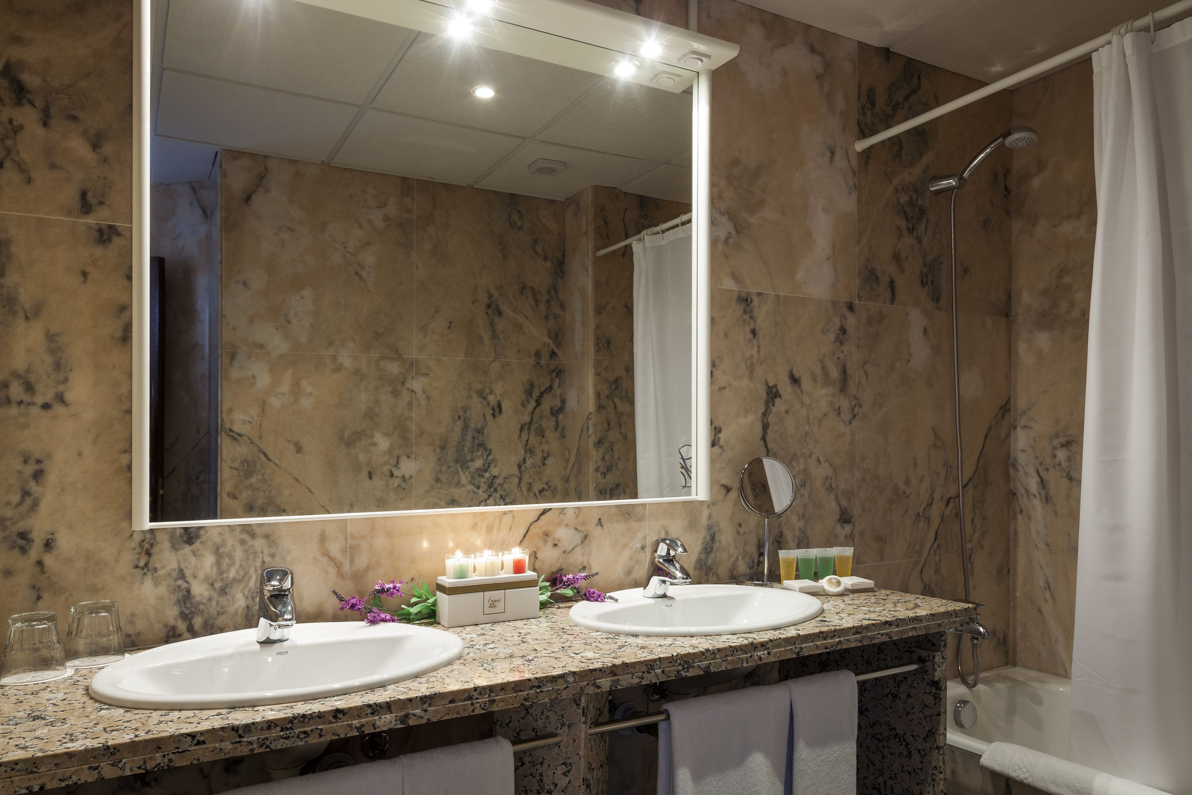 junior suite | bathroom | designer toiletries, hair dryer, bathrobes, slippers