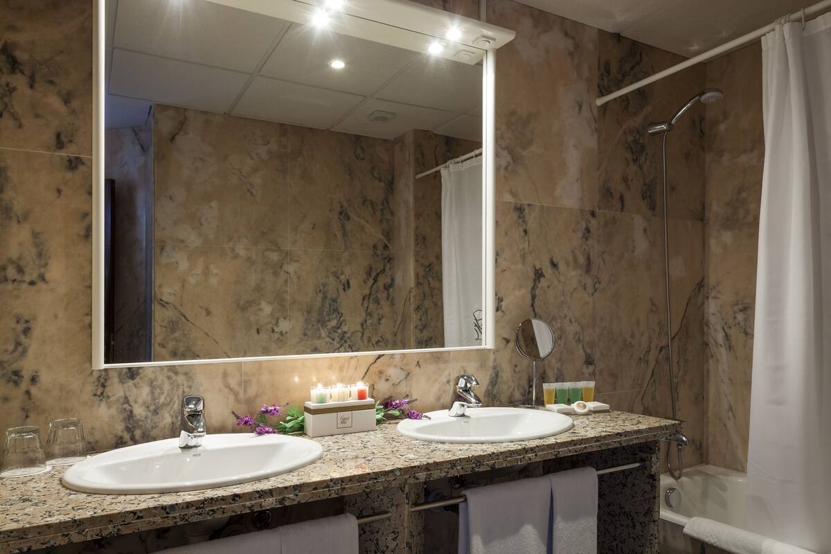 junior suite | bathroom | designer toiletries, hair dryer, bathrobes, slippers