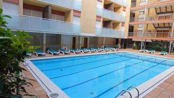 Outdoor pool, open 10:00 AM to 8:00 PM, pool loungers