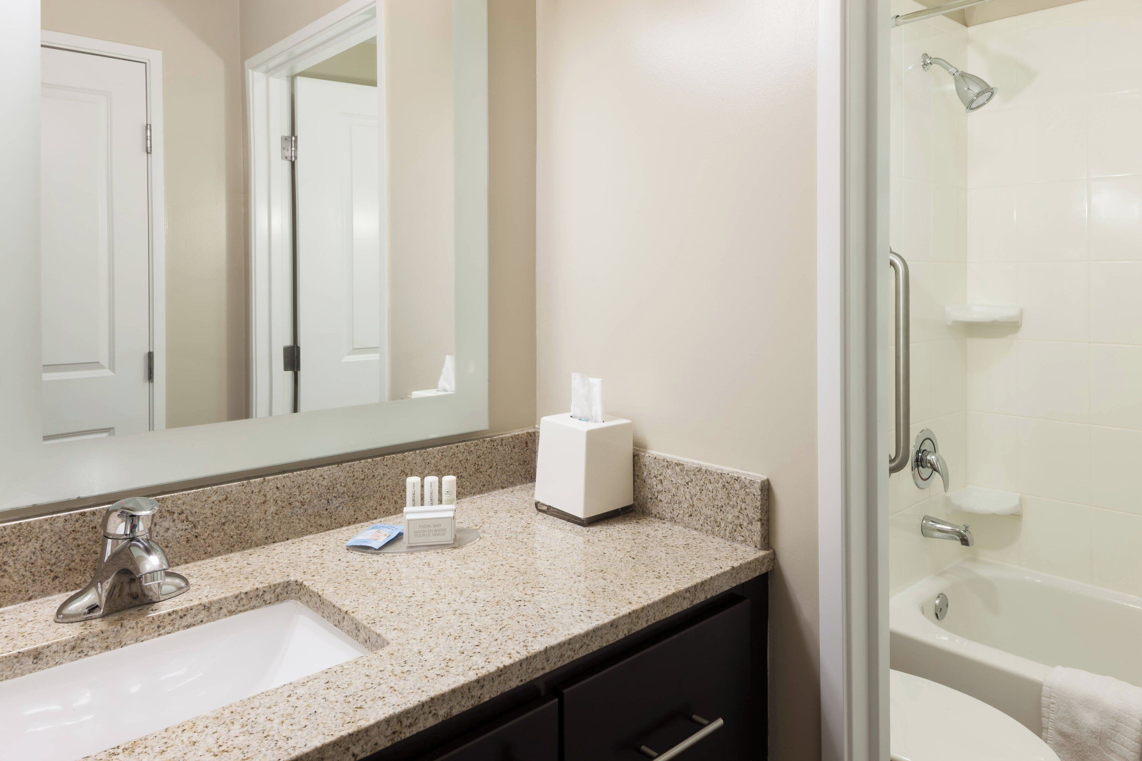 studio, 2 queen beds | bathroom | combined shower/bathtub, hair dryer, towels