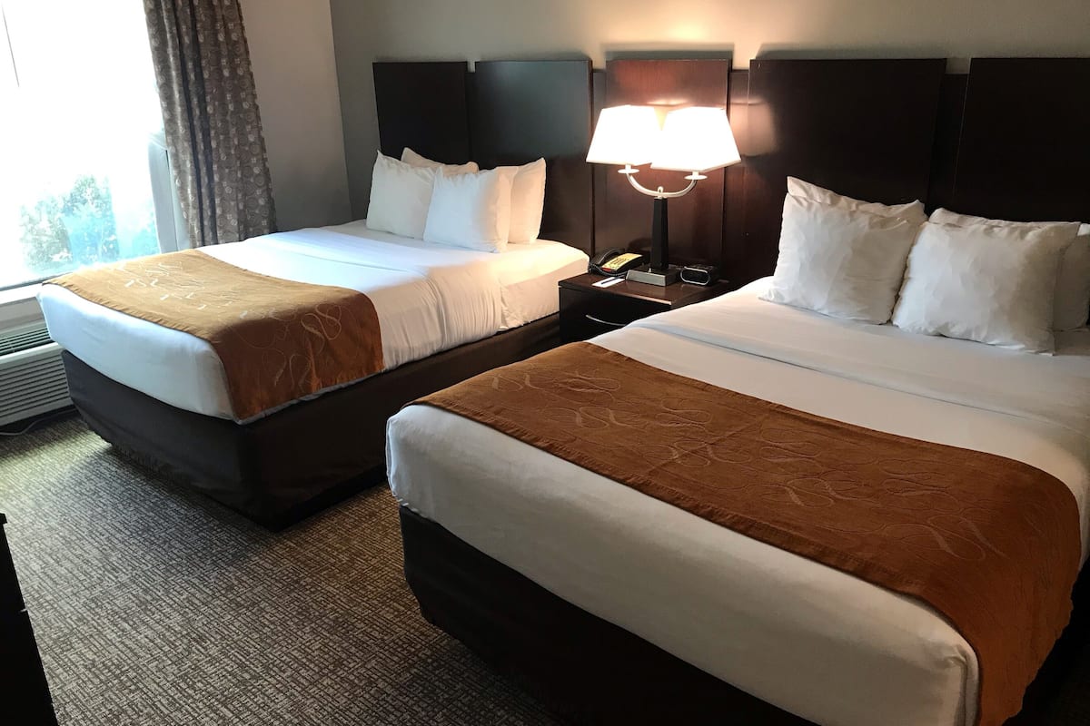 hypo-allergenic bedding, desk, laptop workspace, blackout curtains