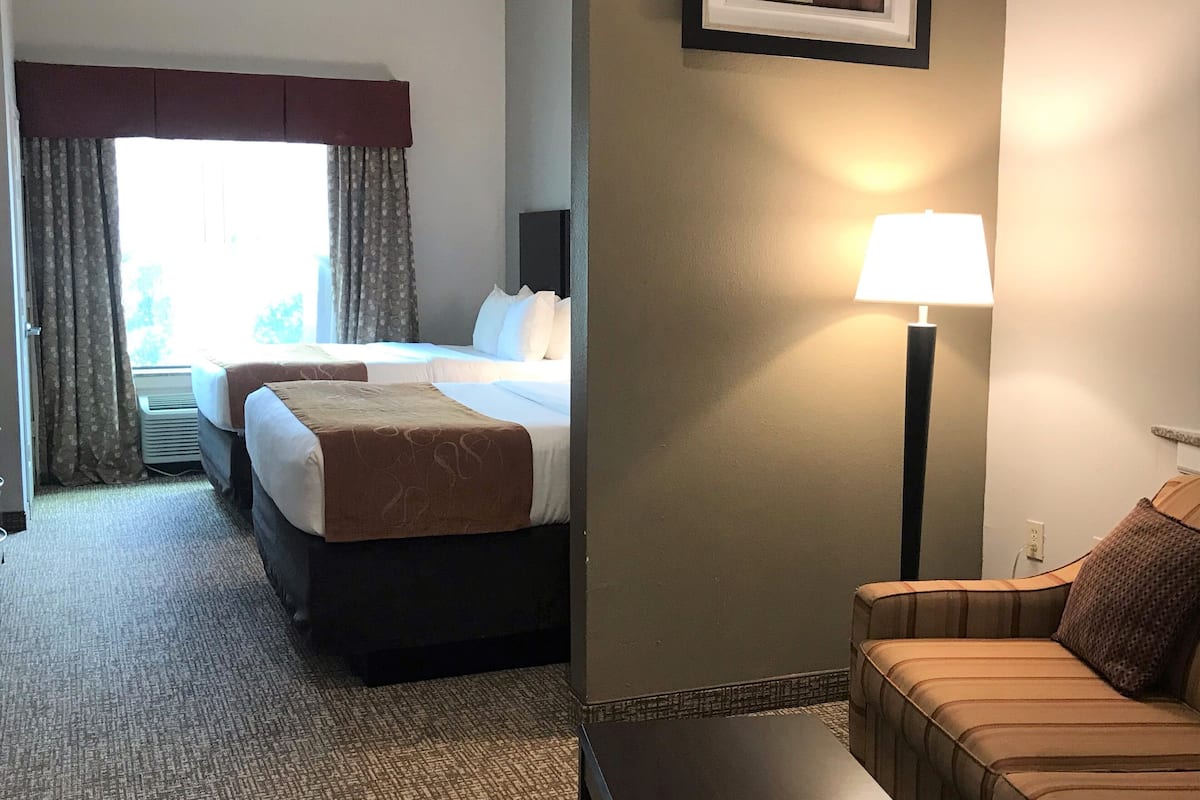 hypo-allergenic bedding, desk, laptop workspace, blackout curtains