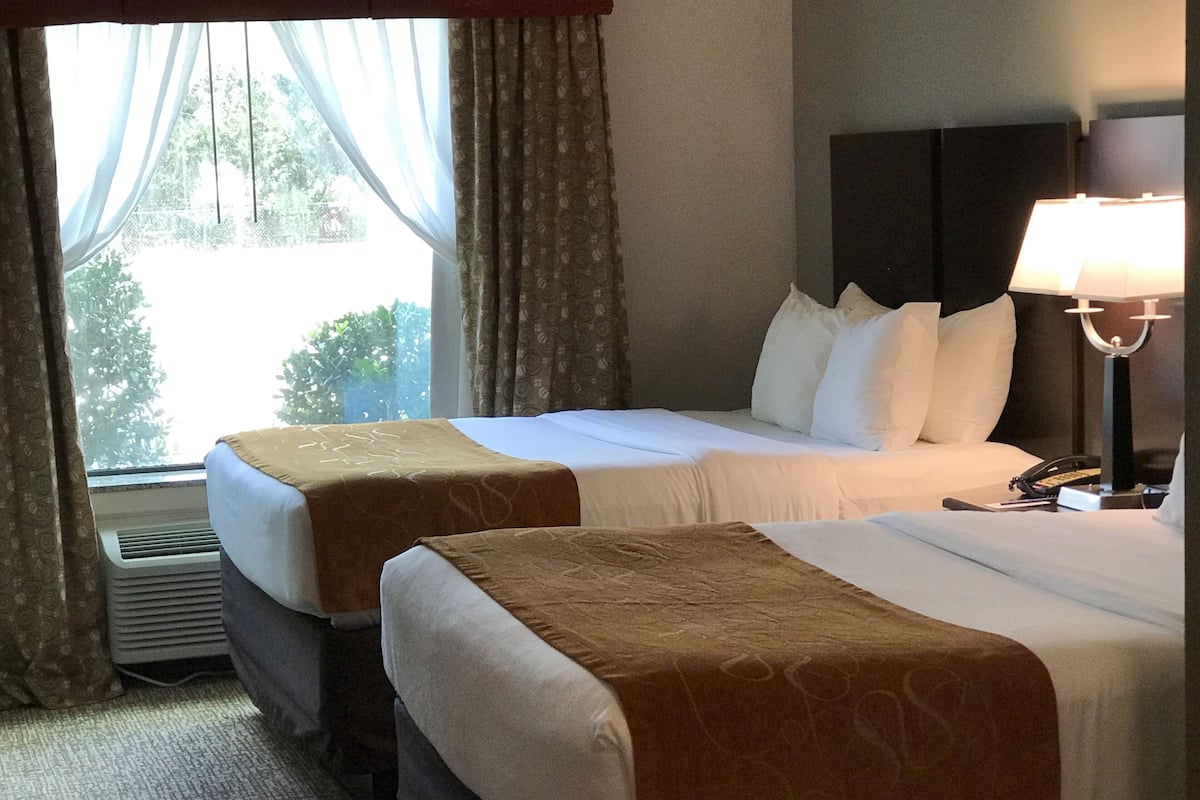 Hypo-allergenic bedding, desk, laptop workspace, blackout curtains