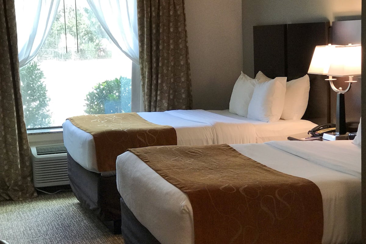 hypo-allergenic bedding, desk, laptop workspace, blackout curtains