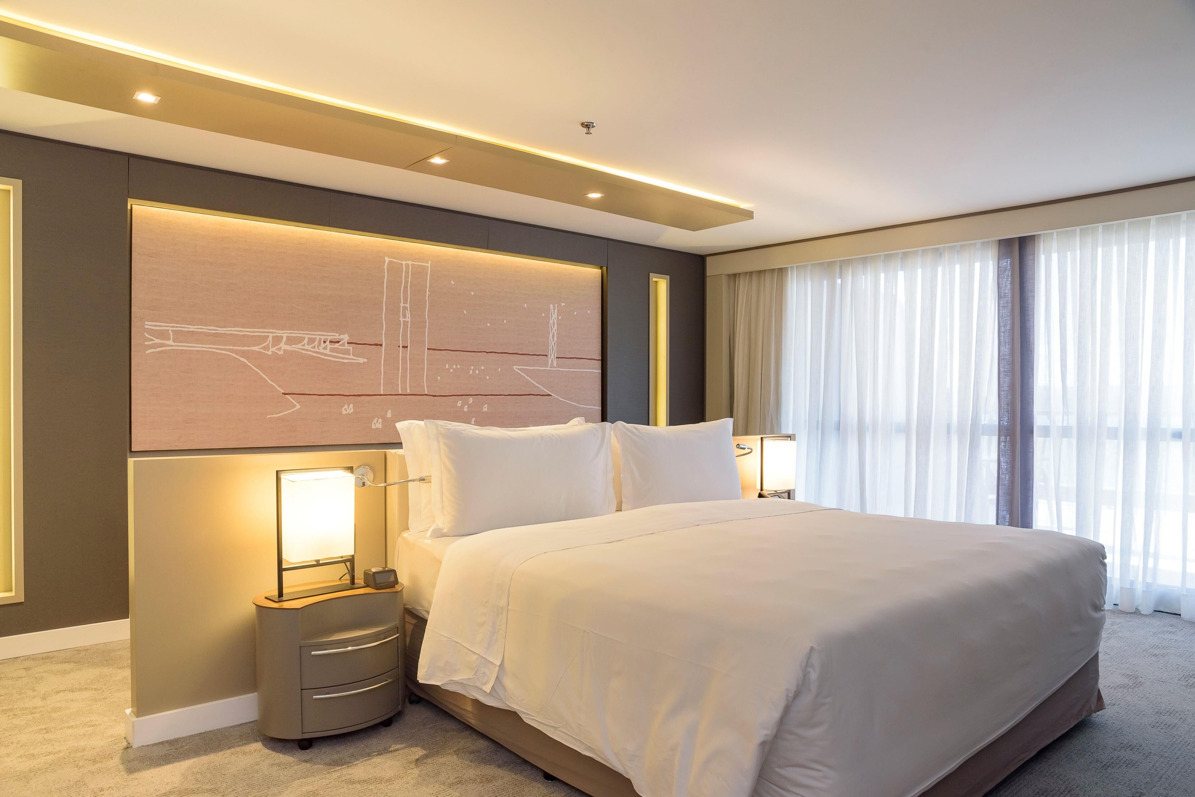 premium room, 1 king bed, pool view | minibar, in-room safe, individually furnished, blackout curtains