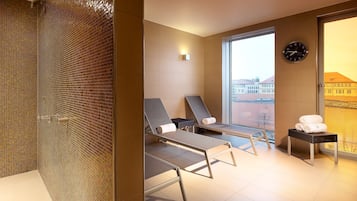Relax in comfort with a city view, two reclining chairs, and a convenient table.