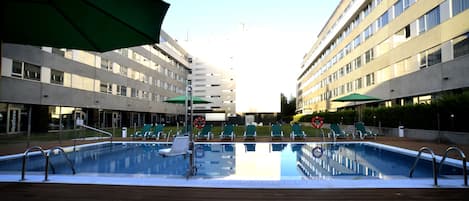 Seasonal outdoor pool, open 11:00 AM to 8:00 PM, pool umbrellas