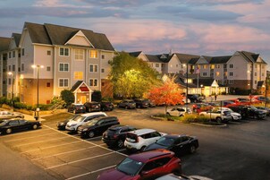 A multi-story parking garage with several cars parked.