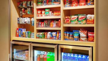 A vending machine with snacks and drinks.