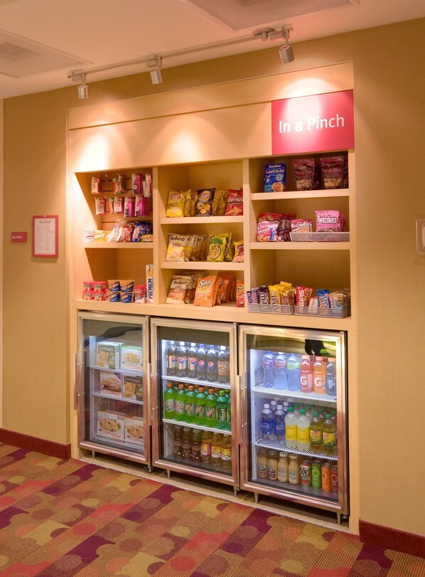 A vending machine area with snacks and beverages. - TownePlace Suites by Marriott Omaha West (Omaha)