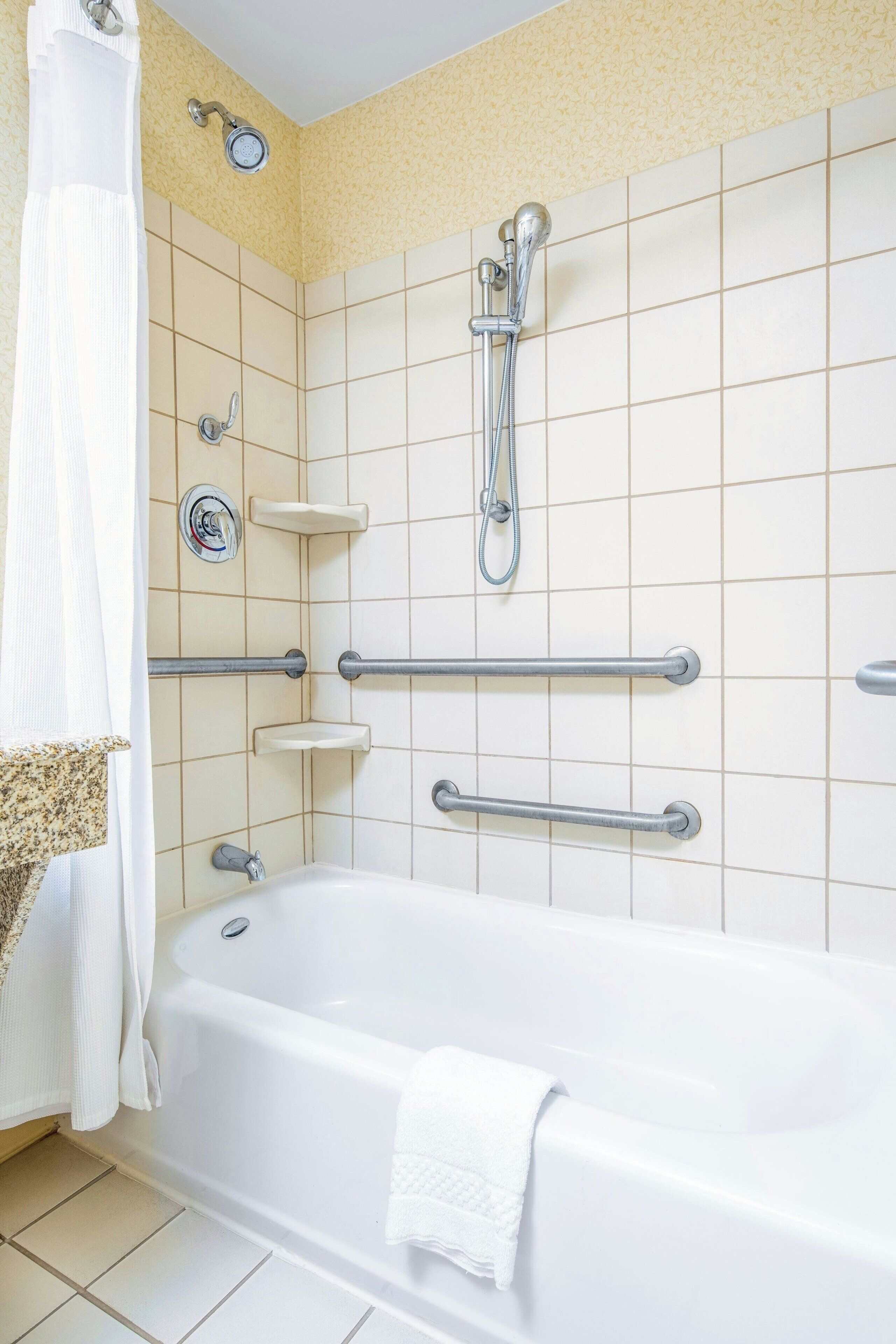 room, 2 queen beds | bathroom | free toiletries, hair dryer, towels