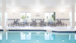 A pool area with lounge chairs and a sign stating "No Lifeguard On Duty." - Fairfield Inn & Suites South Boston (South Boston)
