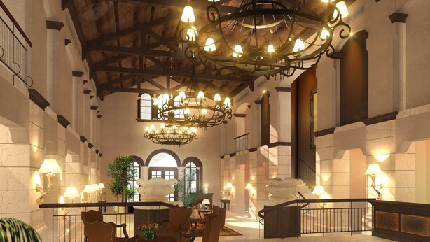 A spacious lobby with a high ceiling, ornate chandeliers, and a central seating area with a round table and chairs. - Arabian Ranches Golf Club (Dubai)