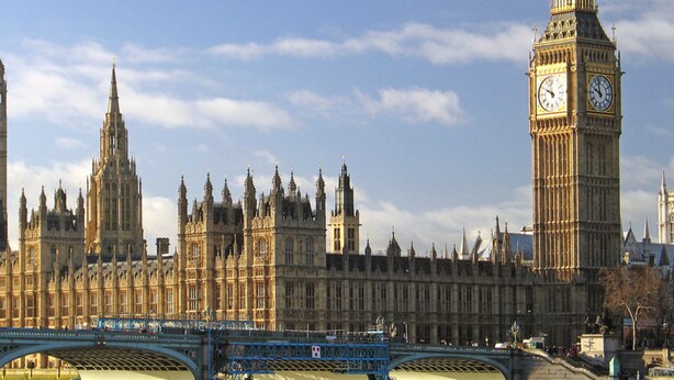 A historic building with multiple spires and a prominent clock tower. - Kensal Green Backpackers 1 (London)
