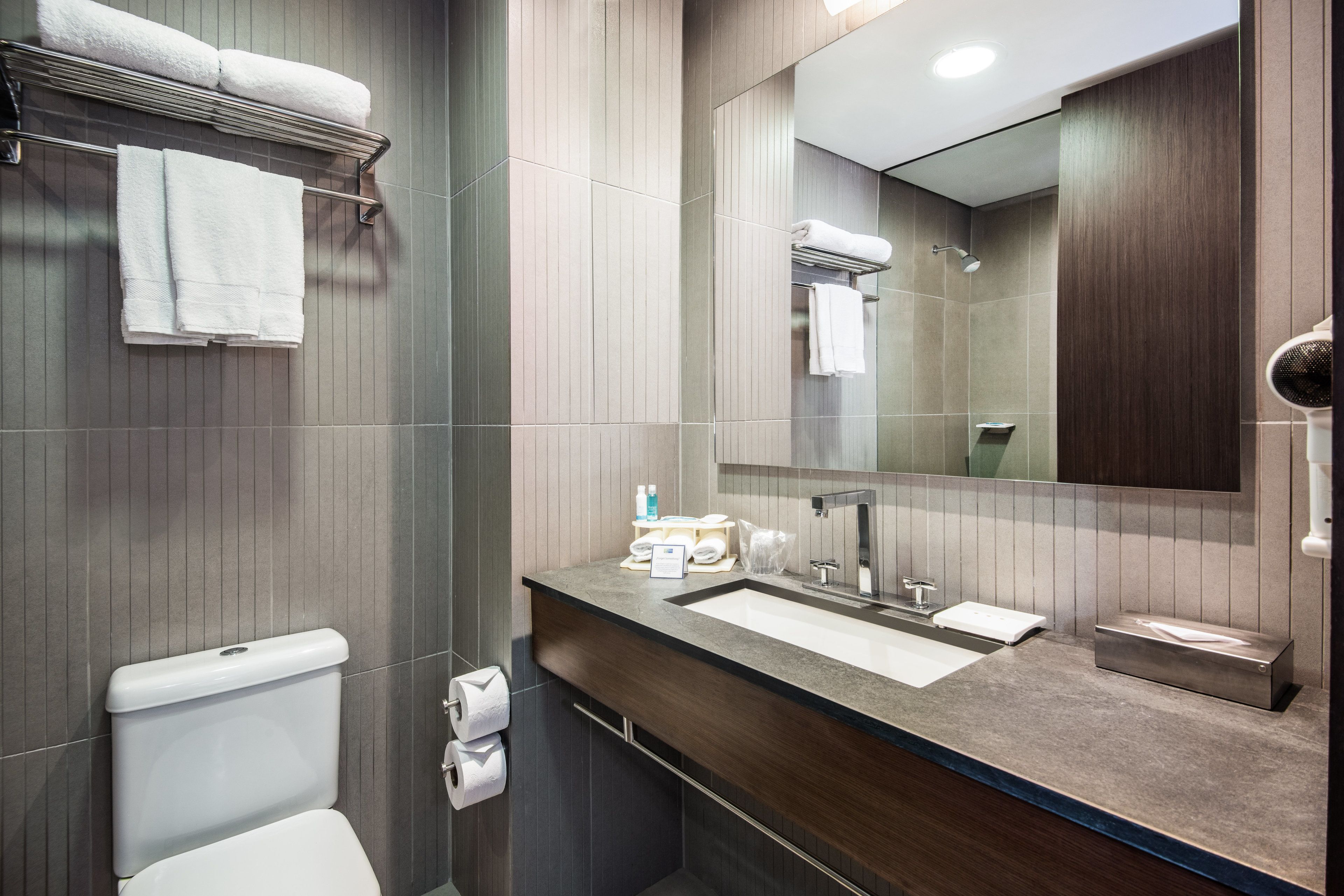 shower, designer toiletries, hair dryer, towels