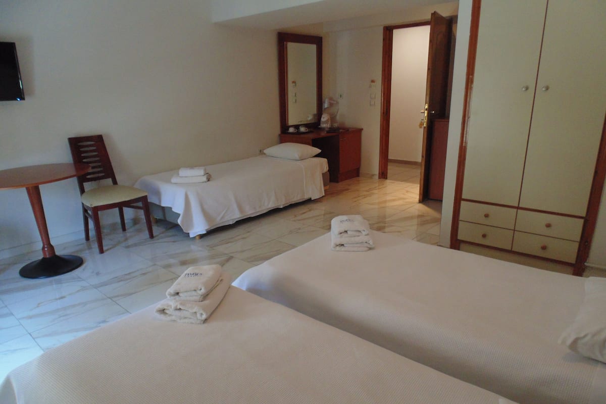 Triple Room | Egyptian cotton sheets, in-room safe, cribs (free)