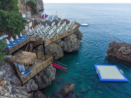 On the beach, sun loungers, beach umbrellas, beach towels