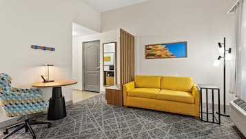 Studio, One King Bed, Non-Smoking | Living area | 25-inch flat-screen TV with cable channels, TV