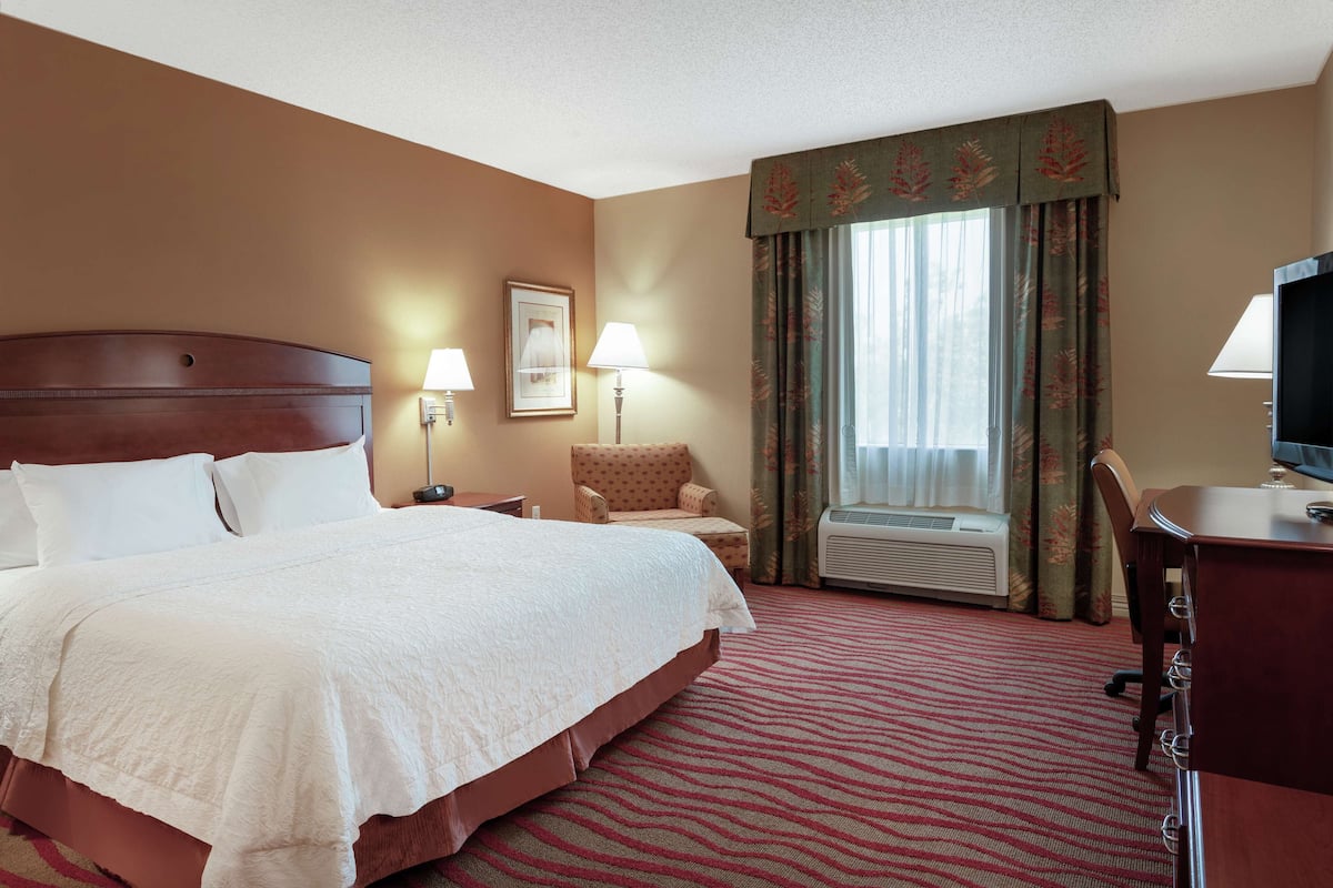 Premium bedding, desk, laptop workspace, iron/ironing board