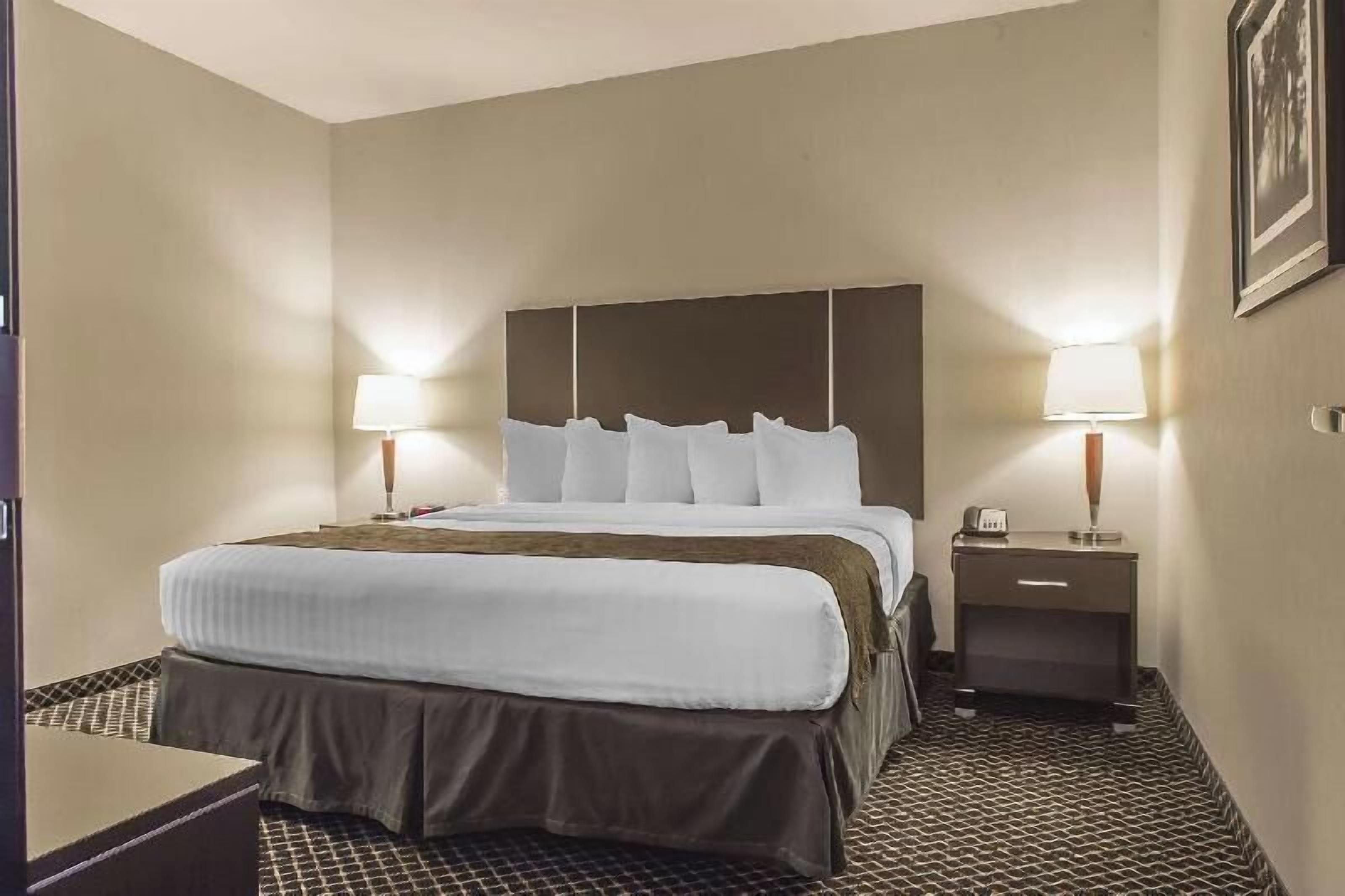 Pillow-top beds, laptop workspace, blackout curtains, iron/ironing board