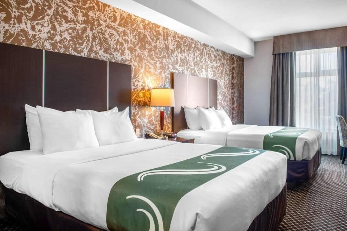 Pillow-top beds, laptop workspace, blackout curtains, iron/ironing board