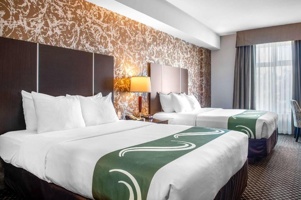 Pillow-top beds, laptop workspace, blackout curtains, iron/ironing board