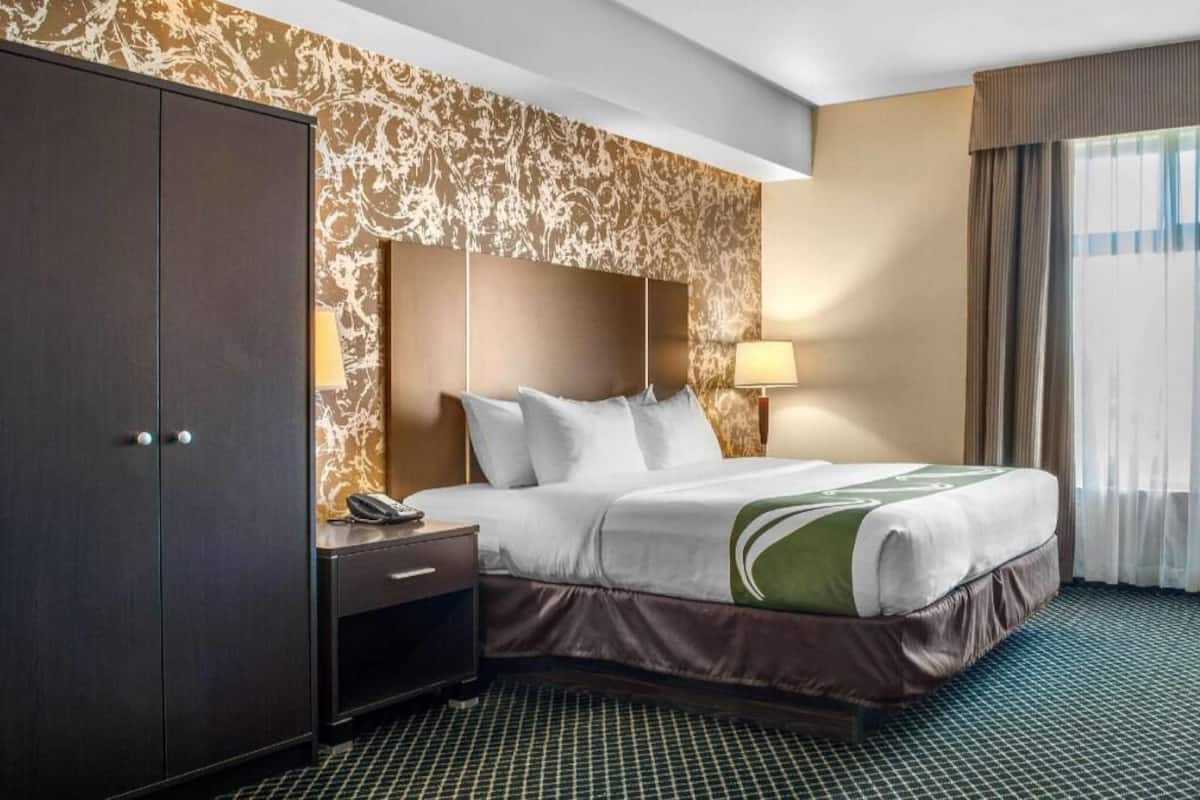 Pillow-top beds, laptop workspace, blackout curtains, iron/ironing board