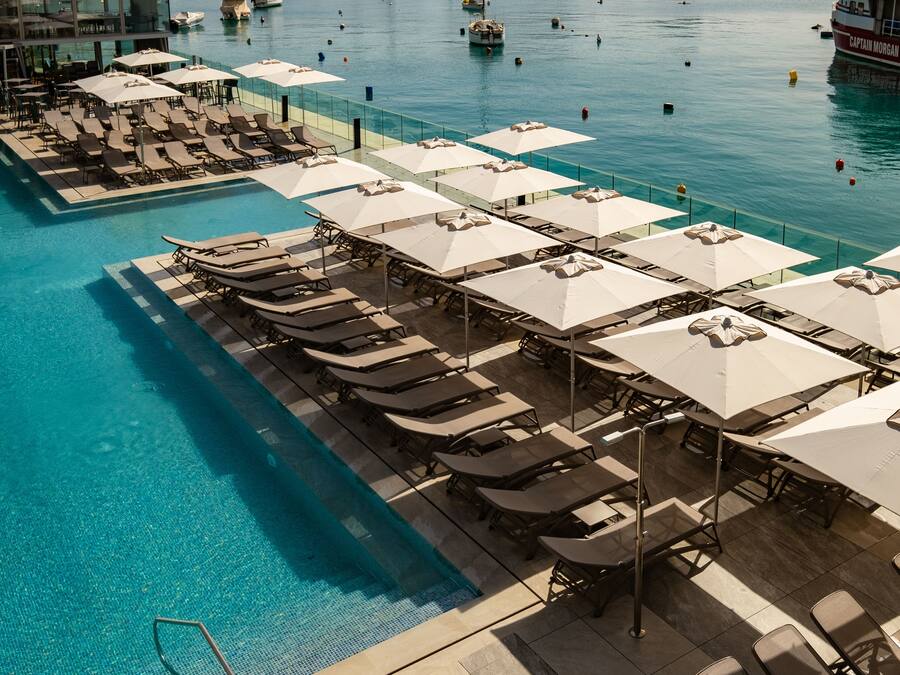 Indoor pool, outdoor pool, pool umbrellas, pool loungers