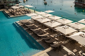 Indoor pool, outdoor pool, pool umbrellas, pool loungers
