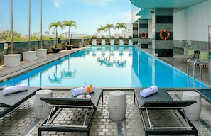 Outdoor pool, open 6:00 AM to 7:00 PM, sun loungers, lifeguards on site