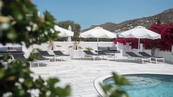 Outdoor pool, open 8:00 AM to 8:00 PM, pool umbrellas, pool loungers