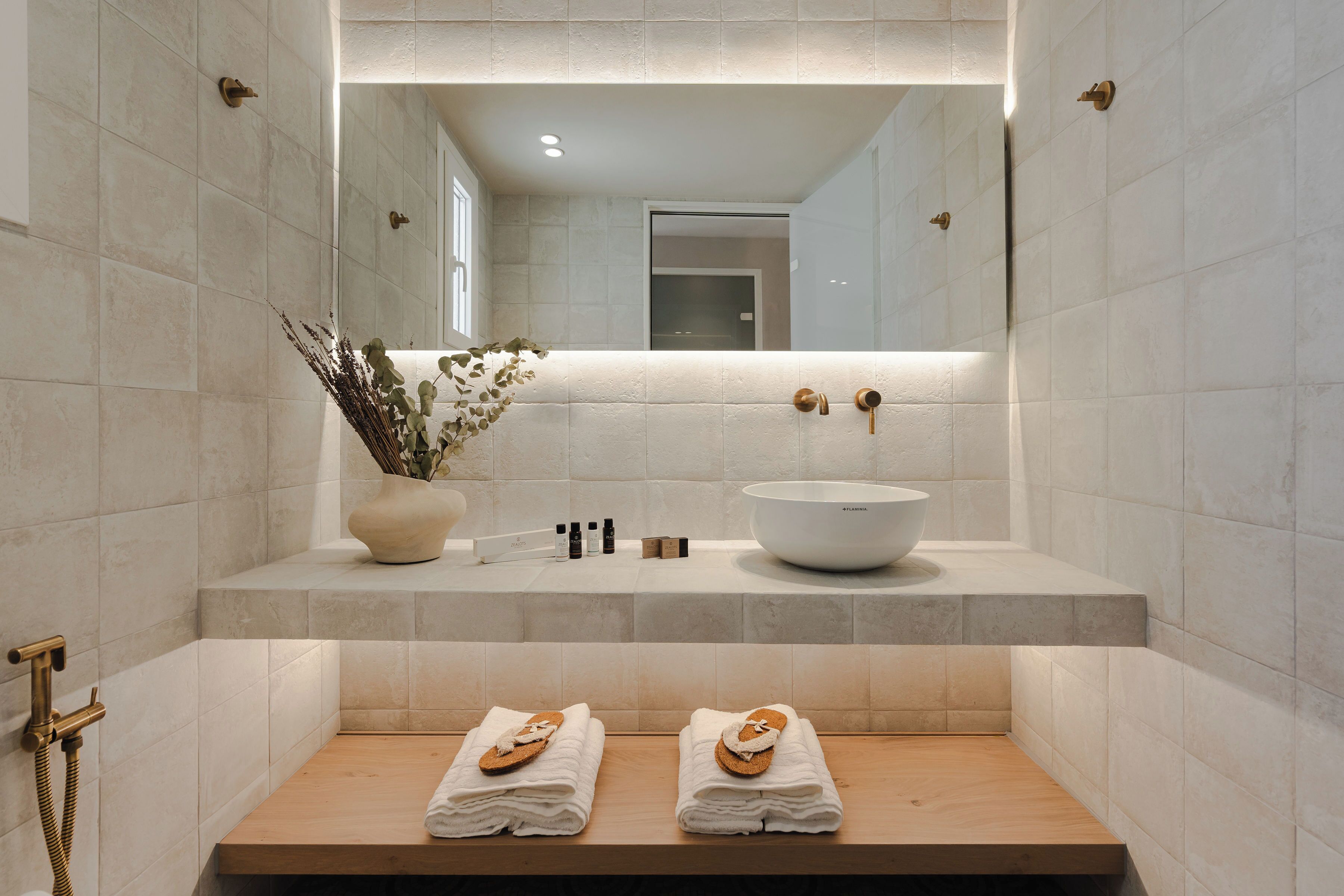 superior studio suite | bathroom | rainfall showerhead, free toiletries, hair dryer, towels