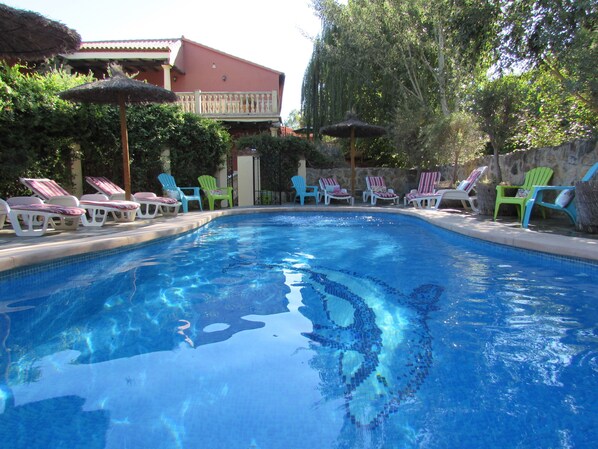 Seasonal outdoor pool, pool umbrellas, pool loungers