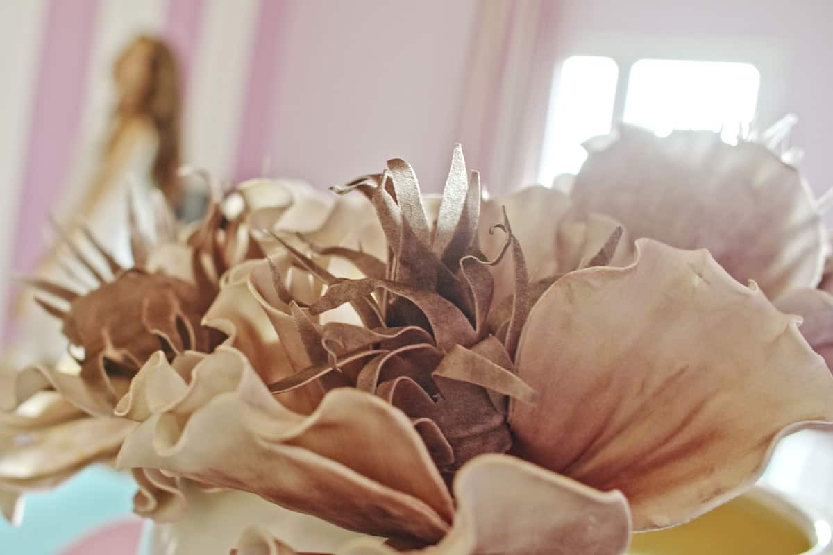 A close-up of a decorative arrangement with ruffled fabric elements.