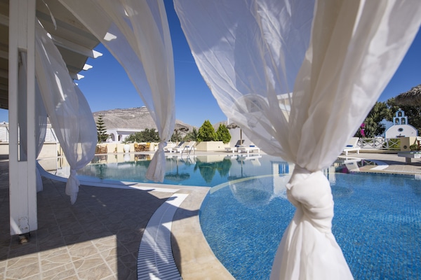 Outdoor pool, pool umbrellas, sun loungers