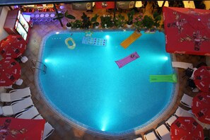 An indoor swimming pool with lounge chairs and umbrellas around it. - Hotel Italia Nessebar (Nessebar)
