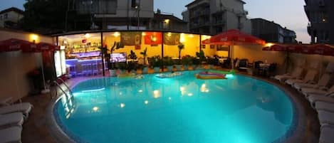 Seasonal outdoor pool, open 7 AM to midnight, pool umbrellas