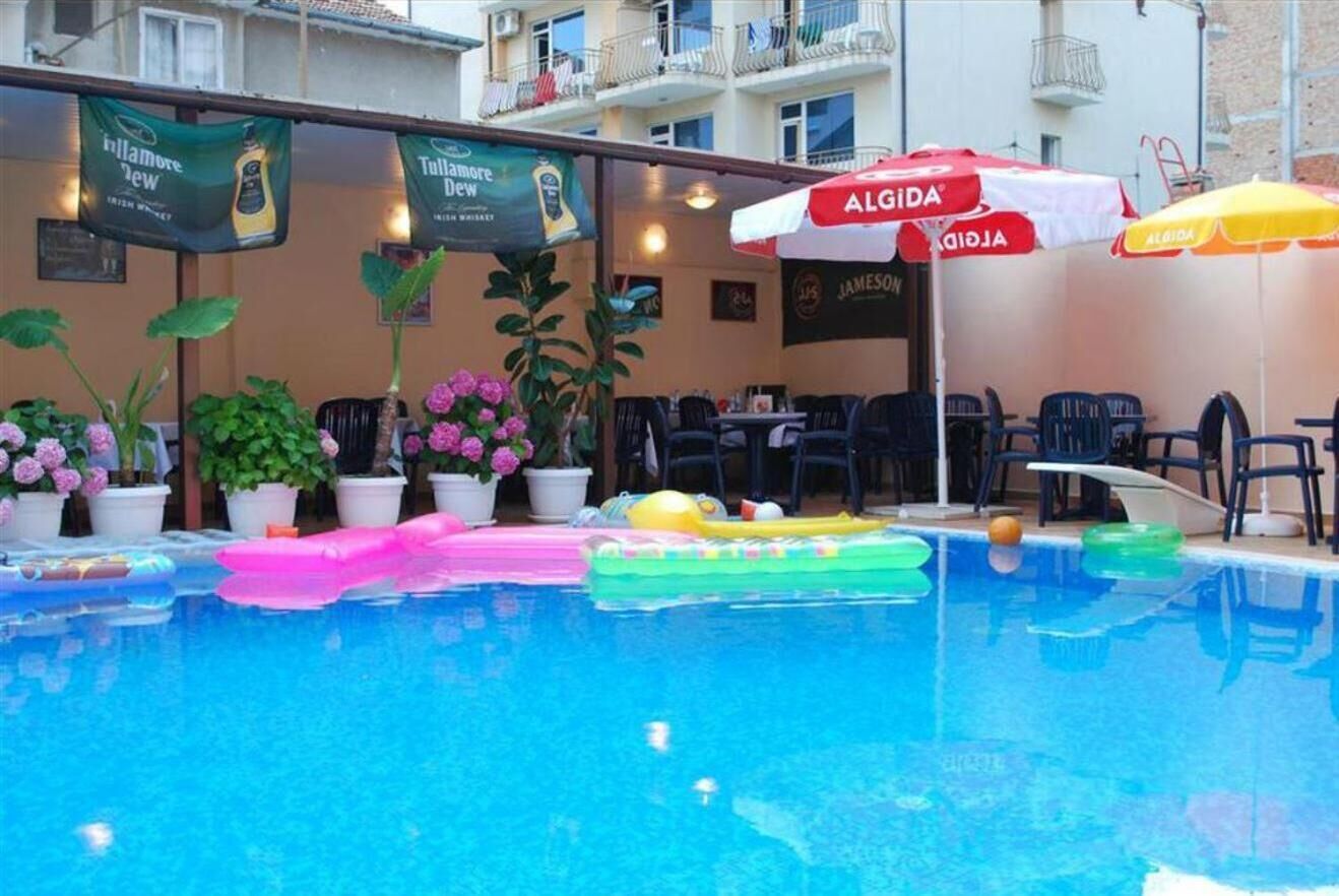 seasonal outdoor pool, pool umbrellas, pool loungers