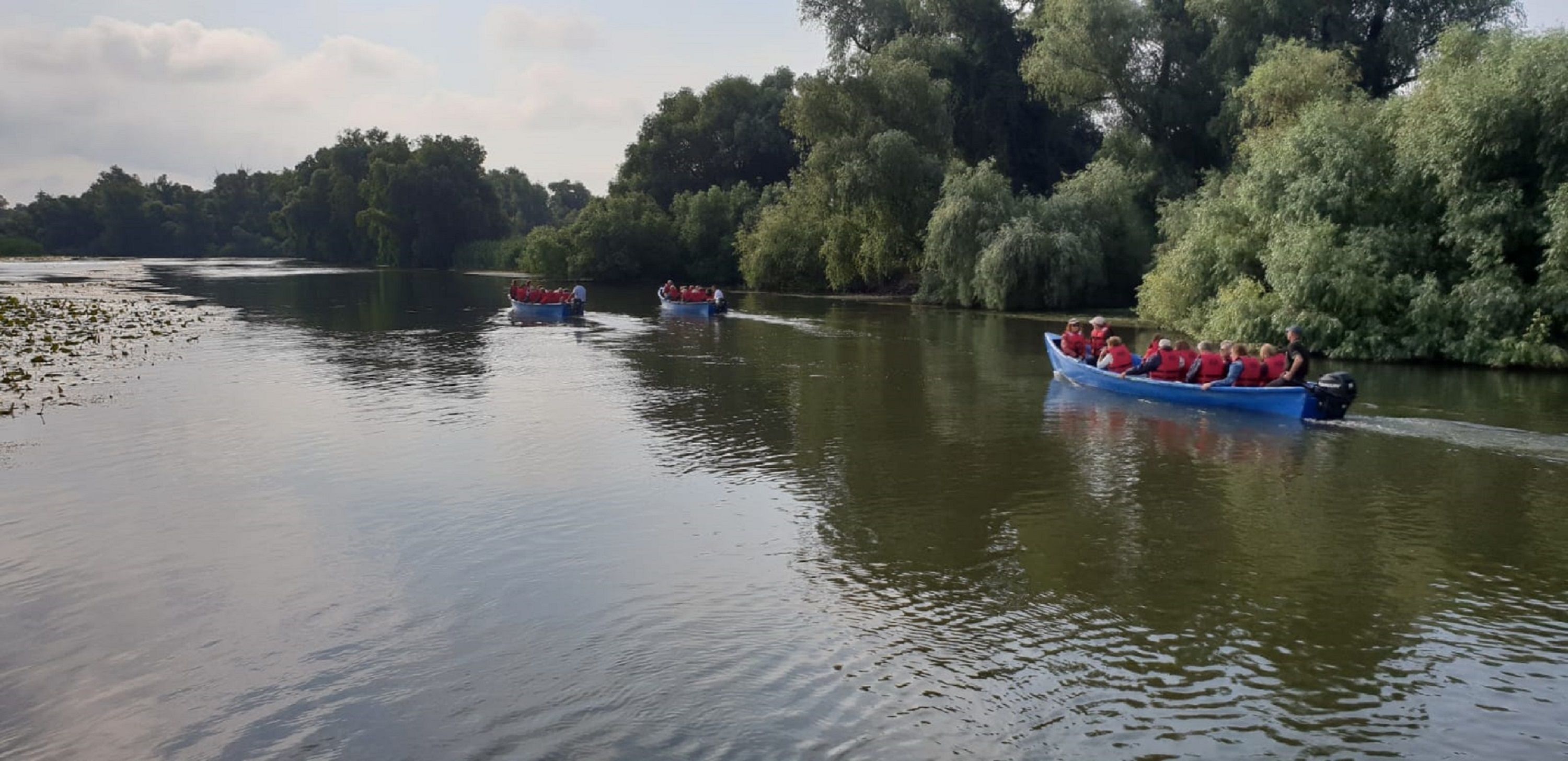 A river with boats carrying passengers.