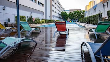 Seasonal outdoor pool, pool loungers
