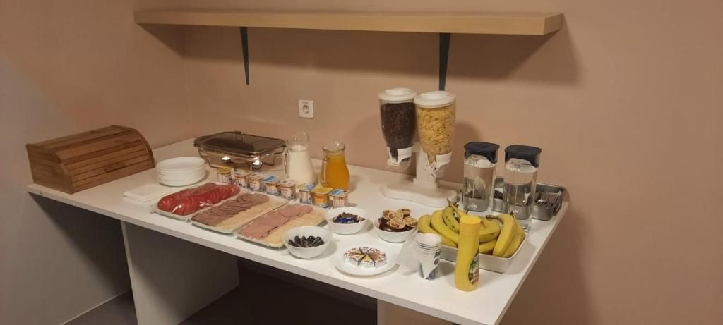 A breakfast buffet with various food items and condiments.